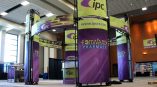 Curved fabric trade show display with metal frame and graphic panels in Chicago Downtown.