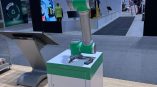 Freestanding tradeshow display with robotic arm and touchscreen kiosk in Chicago Downtown.