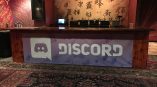 Vinyl banner with logo attached to wooden bar front in indoor venue Chicago Downtown.