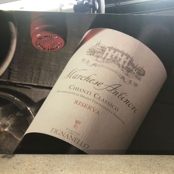 Large printed canvas wall art featuring a close-up of a wine bottle label in Chicago Downtown.