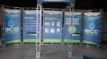 Curved fabric tradeshow display with aluminum frame and overhead banner in Chicago Downtown.