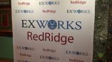 Fabric step and repeat banner with printed logos on a frame stand in Chicago Downtown.