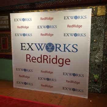 Fabric step and repeat banner with printed logos on a frame stand in Chicago Downtown.