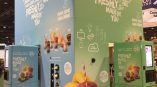 Two-sided fabric trade show display with fruit graphics and text in Chicago Downtown.