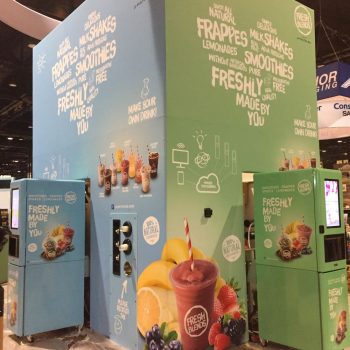 Two-sided fabric trade show display with fruit graphics and text in Chicago Downtown.