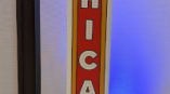 Freestanding custom cut event sign with Chicago letters in red and white in Chicago Downtown.
