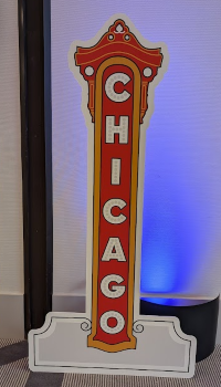 Freestanding custom cut event sign with Chicago letters in red and white in Chicago Downtown.