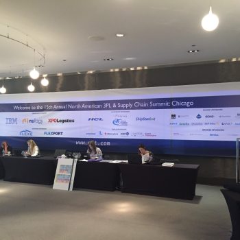 Large fabric event banner with sponsor logos hanging on a wall in Chicago Downtown.