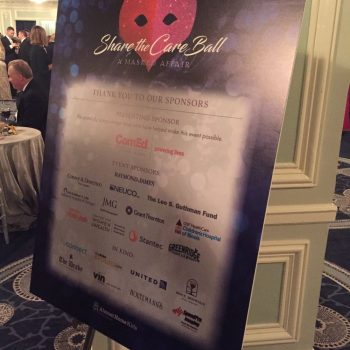 Freestanding foam board event sign with printed sponsors and heart graphic in Chicago Downtown.