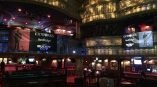 Two large vinyl banners hanging inside an ornate theater with gold trim in Chicago Downtown.