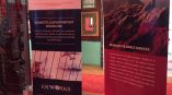 Two retractable vinyl banner stands displayed indoors on wooden floor in Chicago Downtown.