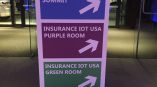 Freestanding tradeshow directional sign with colored panels and arrows in Chicago Downtown.