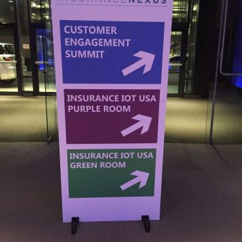 Freestanding tradeshow directional sign with colored panels and arrows in Chicago Downtown.
