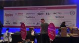 Large fabric event banner with sponsor logos displayed indoors at Chicago Downtown.