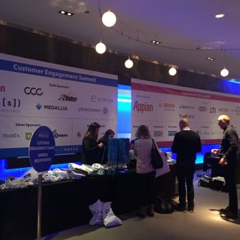 Large fabric event banners mounted on walls at a registration desk in Chicago Downtown.