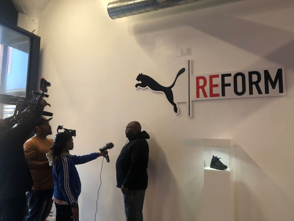 Indoor wall-mounted cutout sign with logo and text at an event in Chicago Downtown.