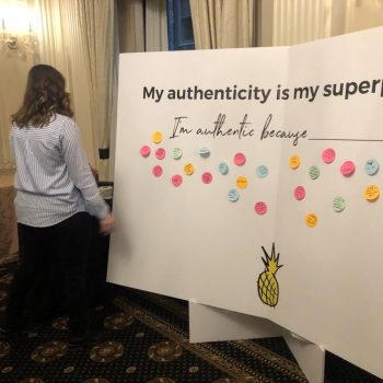 Large freestanding event display board with sticky notes and printed text in Chicago Downtown.