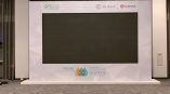 Large freestanding trade show video wall display with printed fabric frame in Chicago Downtown.