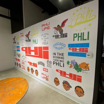 Interior wall mural with various printed vinyl graphics and illustrations in Chicago Downtown.