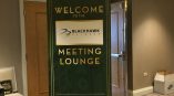 Freestanding fabric event banner sign with metal base in a hotel hallway Chicago Downtown.