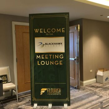 Freestanding fabric event banner sign with metal base in a hotel hallway Chicago Downtown.