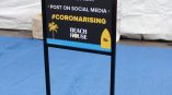 Freestanding metal frame sign with printed event instructions on black board in Chicago Downtown.