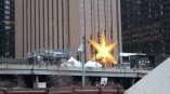 Large illuminated star-shaped event sign mounted on a building in Chicago Downtown.