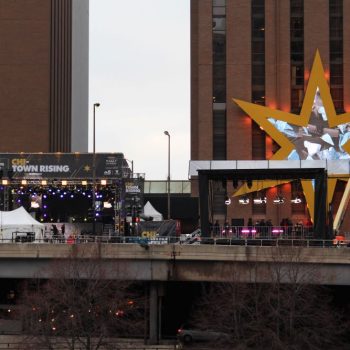 Large event stage banner and star-shaped wall sign installation in Chicago Downtown.