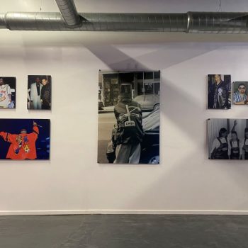 Acrylic photo prints mounted on a white wall in an event space in Chicago Downtown.