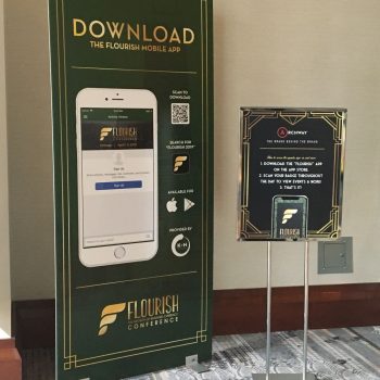 Two event signs including a large freestanding banner and a metal frame sign in Chicago Downtown.