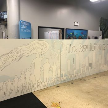 Large stretched canvas wall sign with outlined figures and cityscape in Chicago Downtown.