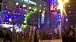 Large event banner and illuminated star wall sign at nighttime in Chicago Downtown.