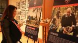 Two large freestanding event posters on easels inside a gallery in Chicago Downtown.