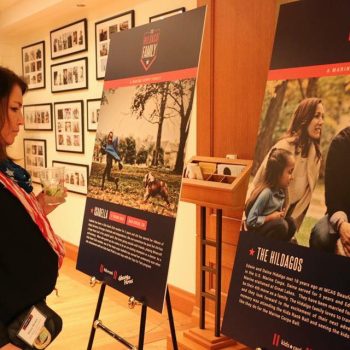 Two large freestanding event posters on easels inside a gallery in Chicago Downtown.