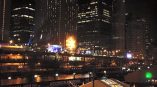Outdoor event tent with illuminated fabric roof graphics and wall banners in Chicago Downtown.
