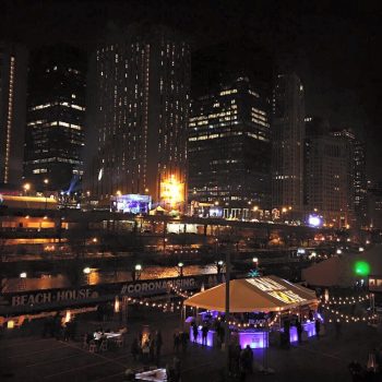 Outdoor event tent with illuminated fabric roof graphics and wall banners in Chicago Downtown.