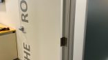 Interior office door with vinyl lettering and a printed wall sign in Chicago Downtown.