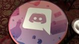 Round vinyl table wrap with digital graphic print on wooden table in Chicago Downtown.