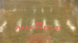Red floor graphics applied on polished concrete floor inside an office in Chicago Downtown.