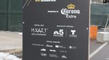 Freestanding event banner with grommets on black vinyl in Chicago Downtown.