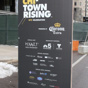Freestanding event banner with grommets on black vinyl in Chicago Downtown.