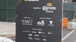 Freestanding event banner with grommets on black vinyl in Chicago Downtown.