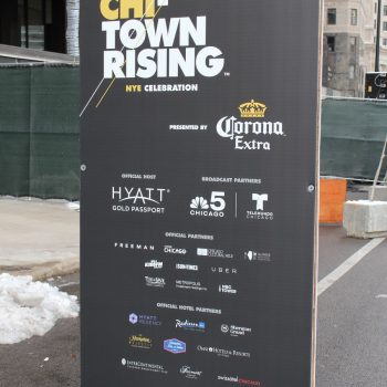 Freestanding event banner with grommets on black vinyl in Chicago Downtown.