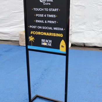 Freestanding metal frame sign with printed event instructions on black board in Chicago Downtown.