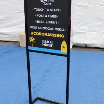 Freestanding metal frame sign with printed event instructions on black board in Chicago Downtown.