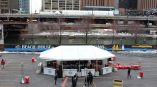 Outdoor event tent with branded vinyl banners and string lights in Chicago Downtown.