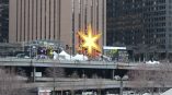 Large illuminated star-shaped event sign mounted on a building in Chicago Downtown.