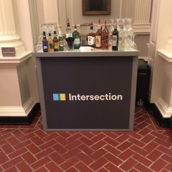 Portable event bar with vinyl graphic wrap and assorted liquor bottles in Chicago Downtown.