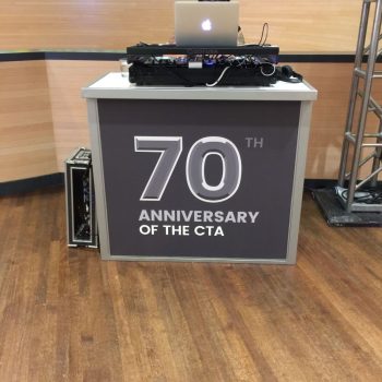 Fabric graphic wrap on a portable event counter with wooden floor in Chicago Downtown.