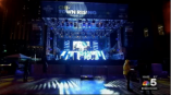 Large event stage with truss lighting and vinyl banner signage in Chicago Downtown.